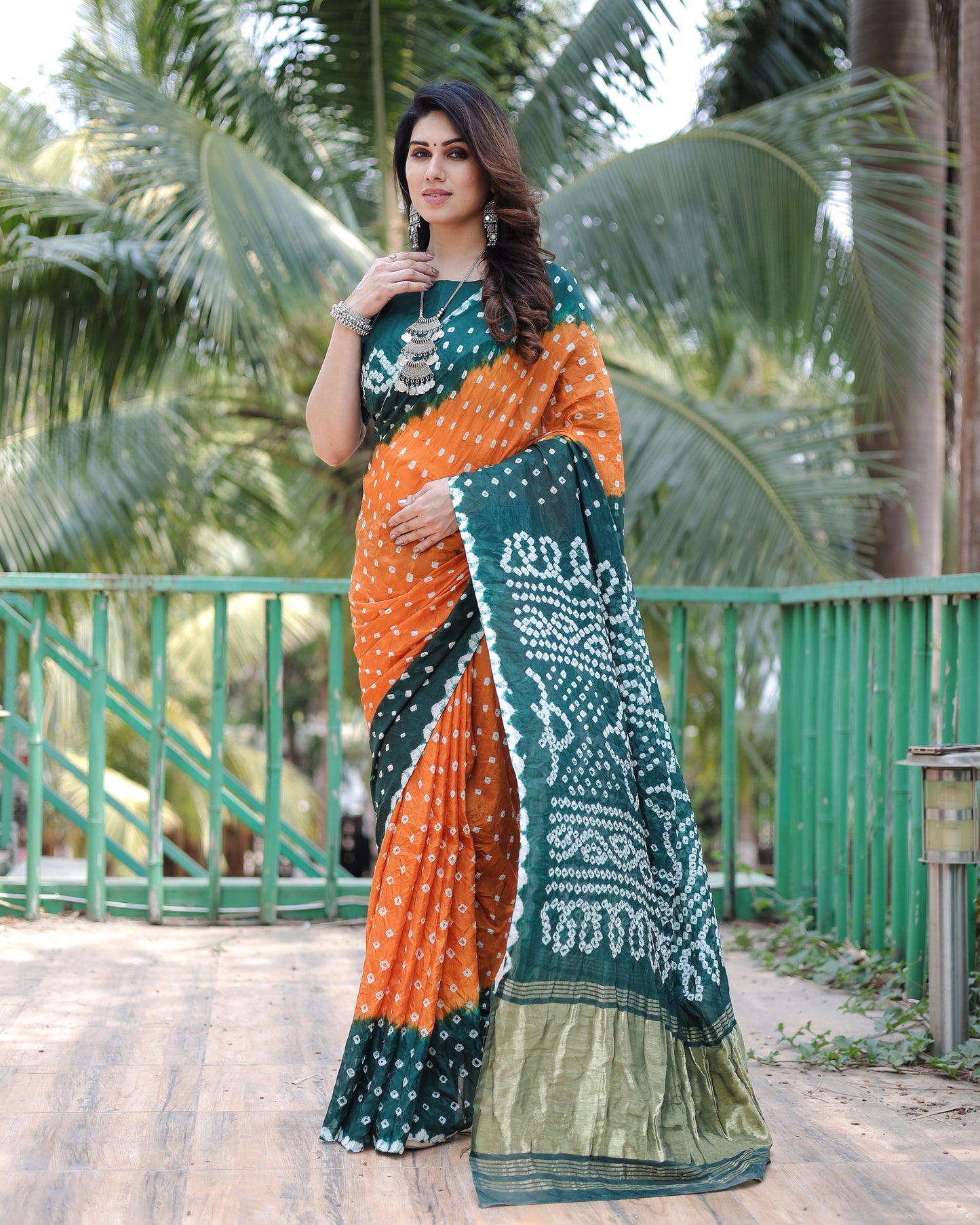 New Premium And High Quality Comfortable Bandhej Silk Drapes That is Super Stylish And Pretty Orange And Green Saree